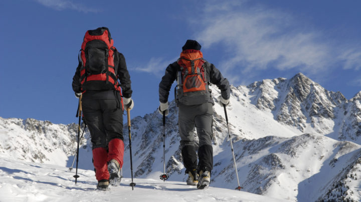 Two-People-Cross-Country-Skiing-on-a-Mountain